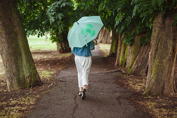 rear-view-of-young-woman-with-umbrella-strolling-i-2025-04-04-02-14-26-utc