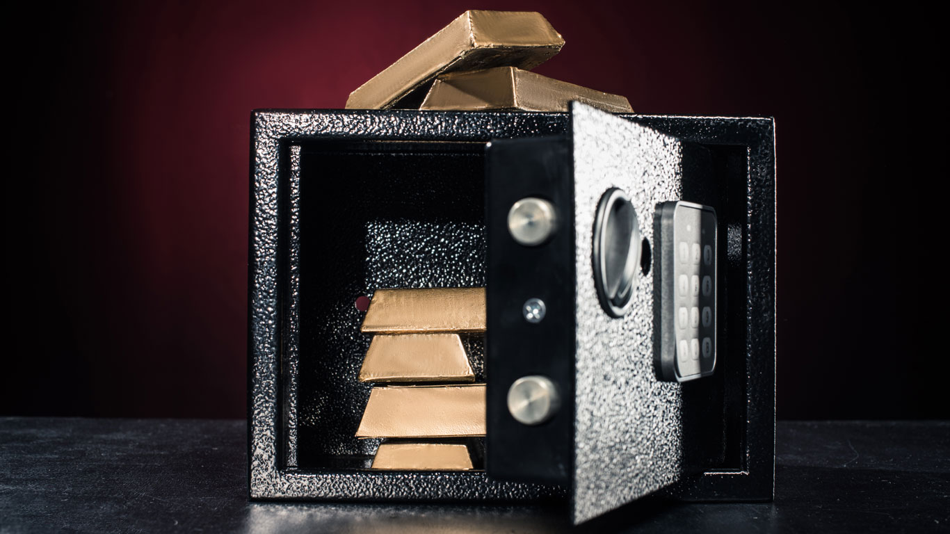 gold-bars-stacked-in-open-safe